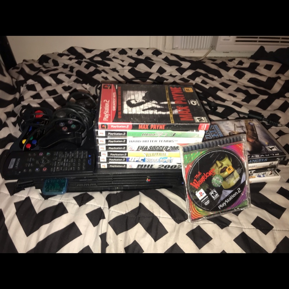 PlayStation 2 with games 2 controllers and wires